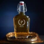 Glass decanter engraved with laurel wreath design
