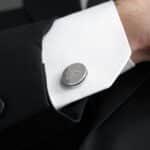 Groom wearing pin stripe cuff links for the wedding day
