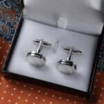 Free engraving is offered with each of the groomsman's initials