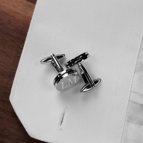 Silver pinstripe cufflinks paired with a white dress shirt