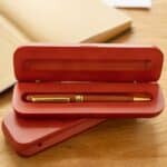 Gift set for bosses featuring a rosewood pen and matching engraved storage case.