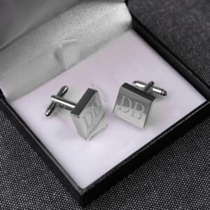 Each pair of silver square cuff links arrives in a black padded gift box