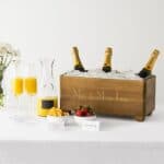 THE TROUGH full of wine and mimosas in a remodeled kitchen