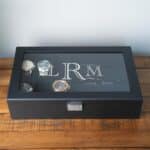 Glass lid watch storage box laser engraved with a monogram
