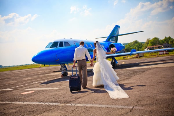 bride and groom conquering a fear of flying before the honeymoon