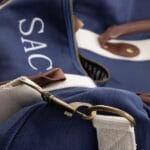 Custom embroidery of initals on the canvas & leather duffle bag