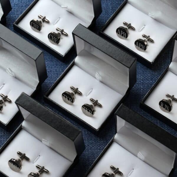 Matching round black cufflinks for groomsmen
