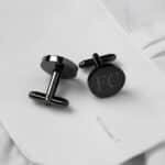 The matching black cufflinks are perfect for the wedding party.