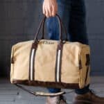 Groomsmen gift travel bag with adjustable shoulder strap and reinforced handles