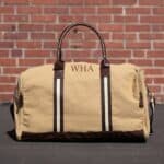 Heavy canvas duffle bag with vegan leather bottom and stylish plaid lining