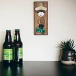 Wooden bottle opener to mount on a wall.
