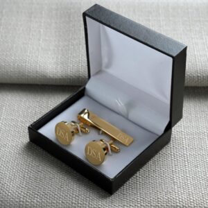 Each gold cufflink and tie bar set arrives in a padded black gift box