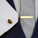 The gold tie clip and tie tack set will match any wedding day attire style