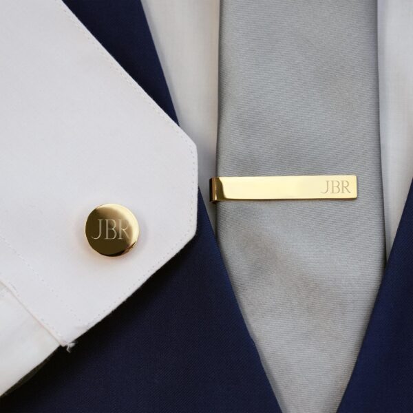 The gold tie clip and tie tack set will match any wedding day attire style