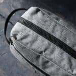 Overhead closeup view of grey dopp kit