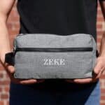 Grey dopp kit held outside