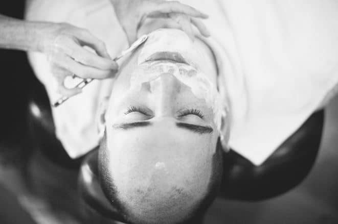 groomsman receiving a clean shave