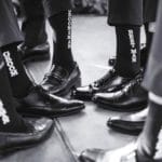 Wedding photos with groom and groomsmen wearing matching socks
