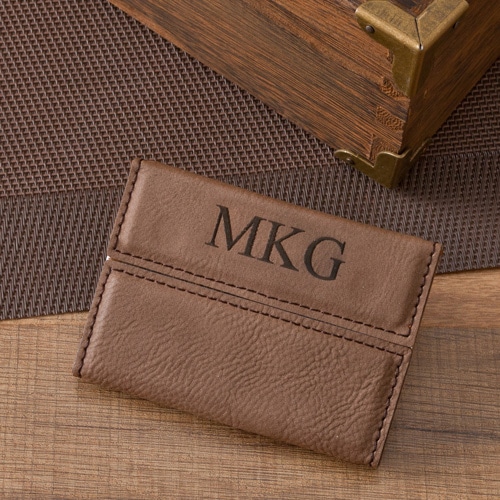 A mocha-brown simulated leather business card holder for your groomsmen.