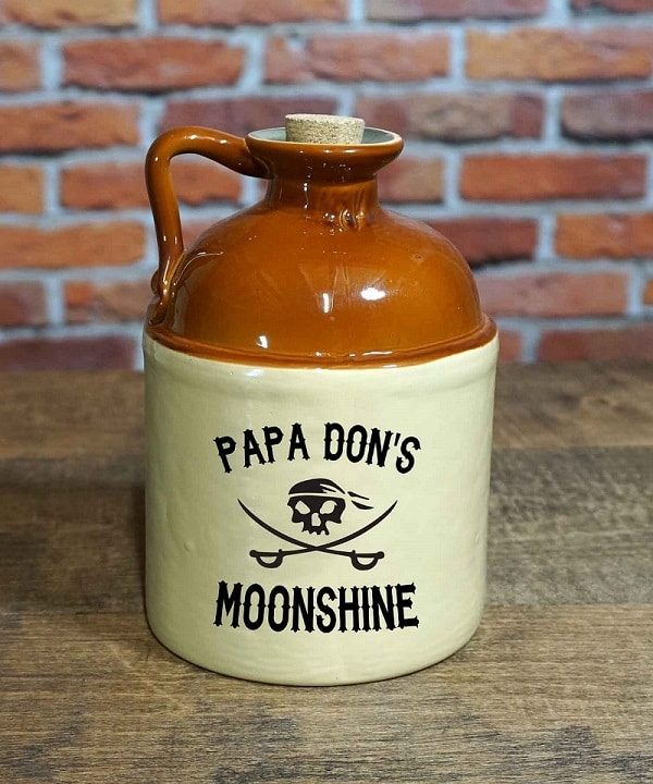 Glass jug that holds 750 ml of your groomsman's homemade moonshine
