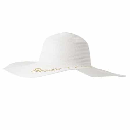 The bridal sun hat features a wide brim with a round top.