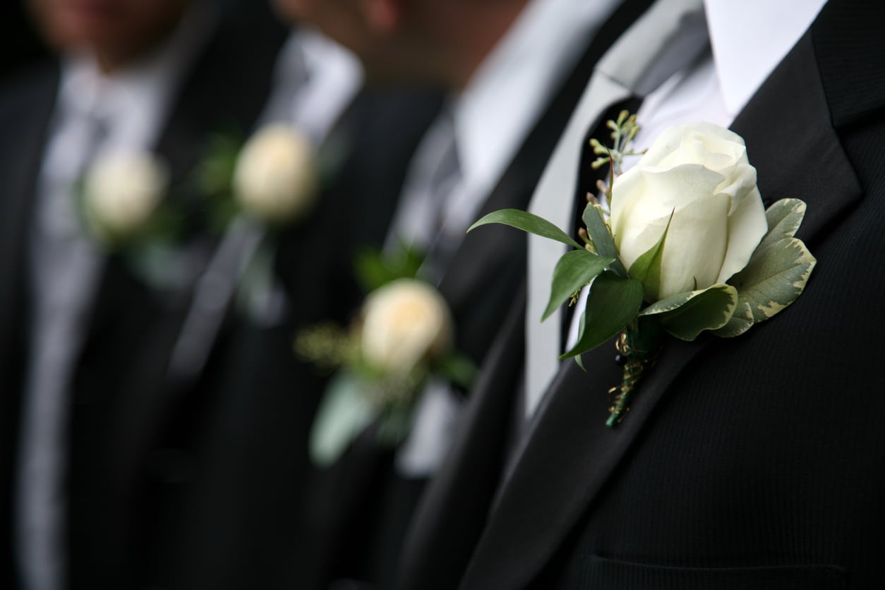 groomsmen in black suits