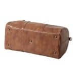 The study bottom of the Vegan Leather Duffle comfortably supports all of the clothes and shoes that you'll transport inside