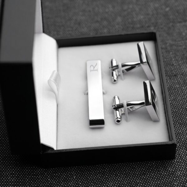 Each cuff link and tie tack set comes in a padded black gift box