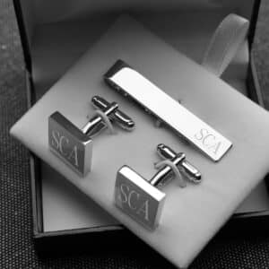 Matching silver square cuff link and tie bar sets for the groomsmen