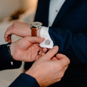 Groomsman wearing silver round cufflinks