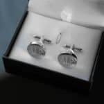 Each pair of silver round cuff links arrives in a black gift box