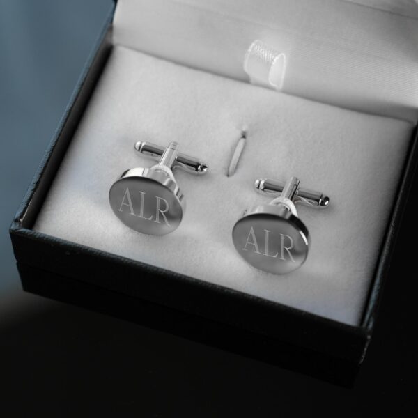 Each pair of silver round cuff links arrives in a black gift box