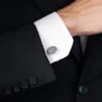 Groom wearing circular silver cuff links for the wedding