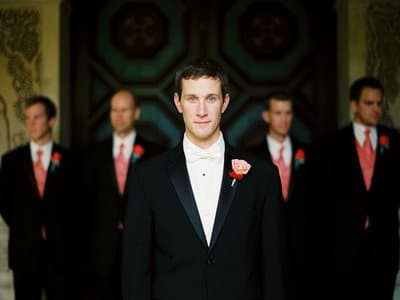 Groom in front of groomsmen