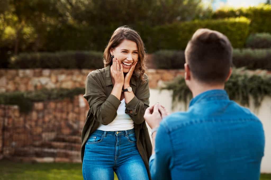 young man proposing to his girlfriend