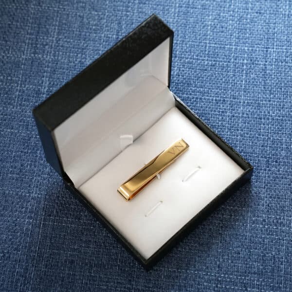 Each gold tie bar arrives in a black gift box for presenting to the groomsmen