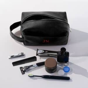 The black leather toiletry bag is a great groomsmen gift for your wedding.
