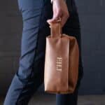 The brown leather dopp kit is easy to carry and will easily fit in your suitcase or luggage.
