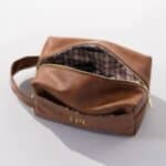 Interior of men's brown leather toiletry bag.