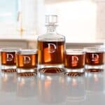 Groomsmen monograms engraved on round whiskey decanter set