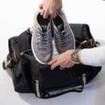 Packing up the groomsmen duffle bag with plenty of room for shoes, outfits and travel accessories.