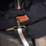 Side-view of the embroidered black nylon duffle bag