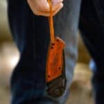 The Elk Ridge Folding Knife features a leather wrist lanyard that can be removed