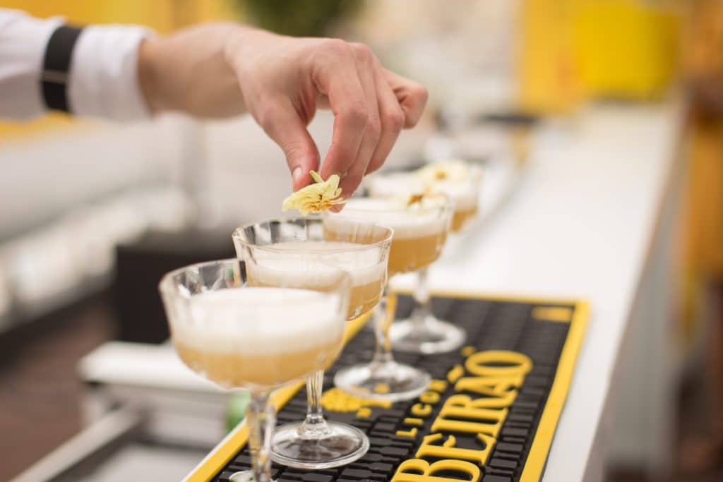 bartender adding garnish to cocktails