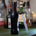 Railroad spike bottle opener engraved with 3 initials