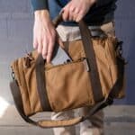 Phone storage case and back side of One Nighter Duffle Bag