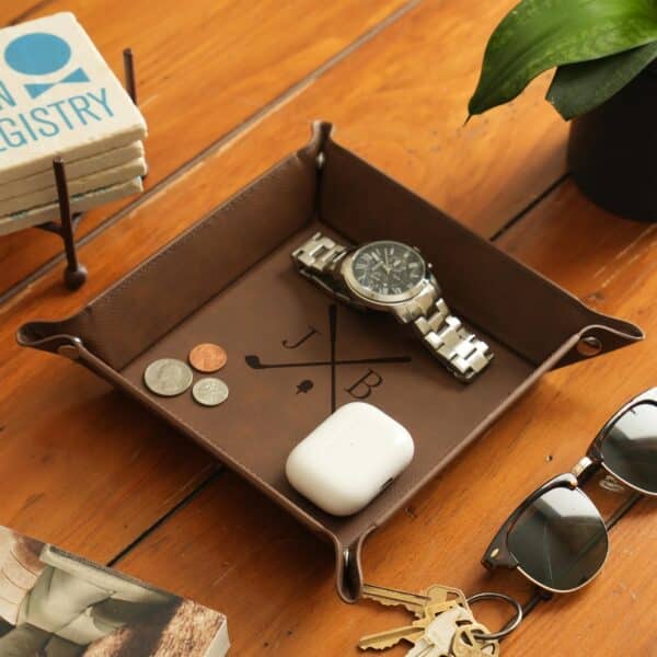 Brown leather stash tray with custom golf club design