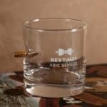 Close-up of groomsman bow tie design engraving on the bullet rocks glass