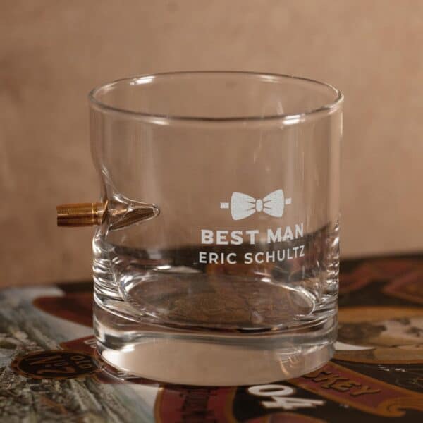 Close-up of groomsman bow tie design engraving on the bullet rocks glass