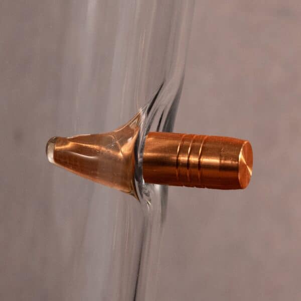 Close-up of the bullet "stuck" in the side of the pint glass